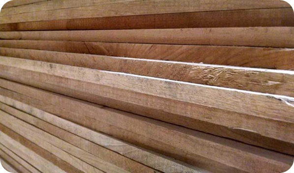 Stacked wood panels showcasing the craftsmanship of Atkin Molding's custom barn doors,